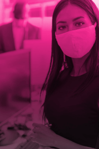 woman wearing a face mask in an office space